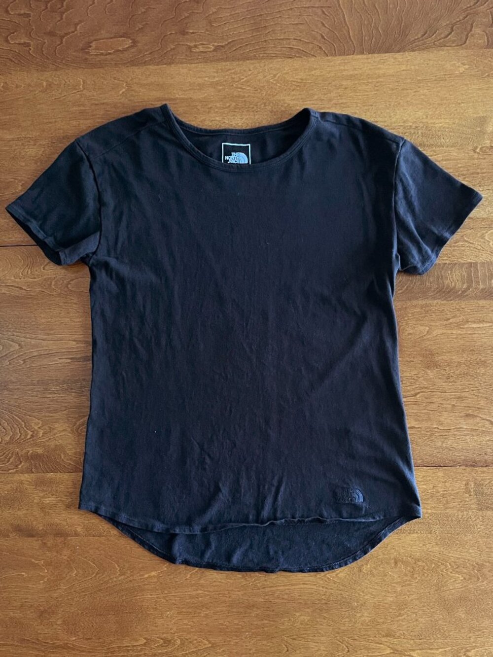 The North Face black rounded-hem tee S